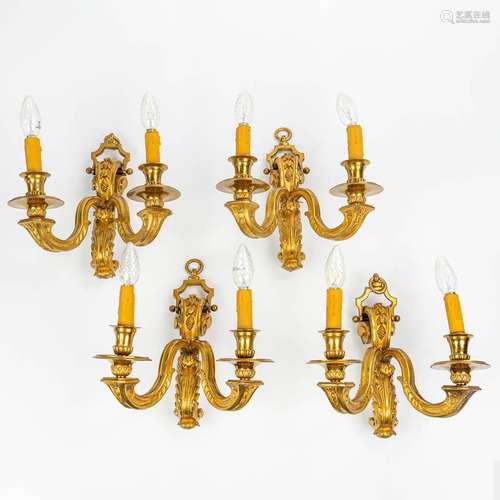 A set of 4 wall lamps made of bronze in Louis XVI style