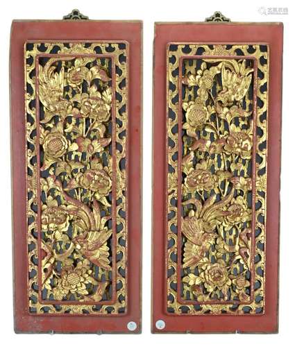 A pair of Chinese carved red lacquer and gilt wood