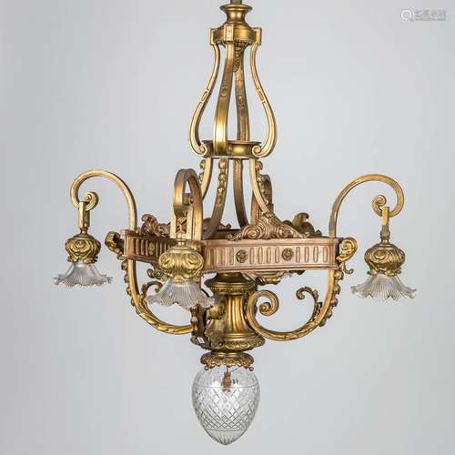 A large chandelier made of bronze in Louis XVI style.