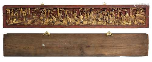 A Chinese gilt-lacquer carved panel depicting figures.