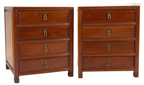 A pair of Chinese hardwood four-drawer bedsides with