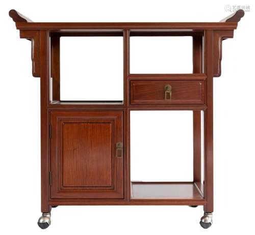 A Chinese hardwood altar cabinet on rounded wheels with