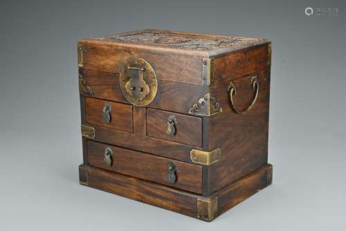 A Chinese hardwood seal chest. Of rectangular form