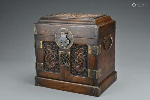 A Chinese hardwood seal chest. Of rectangular form