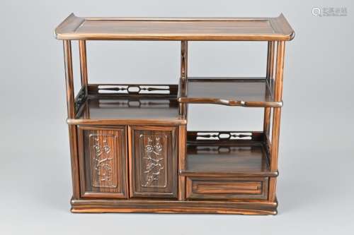 A Chinese Hardwood Tabletop Display Stand With Doors