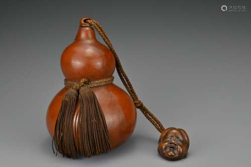 A Japanese double-gourd Hyotan sake flask with wooden