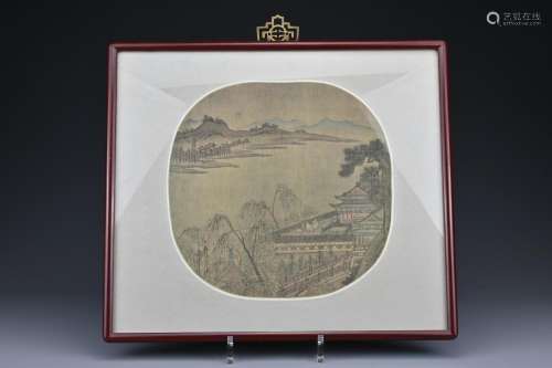 A Chinese framed painting on silk of a mountain and
