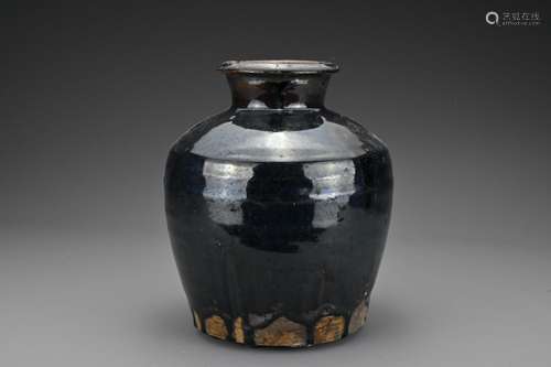 A Chinese Ming dynasty black glazed storage jar. The