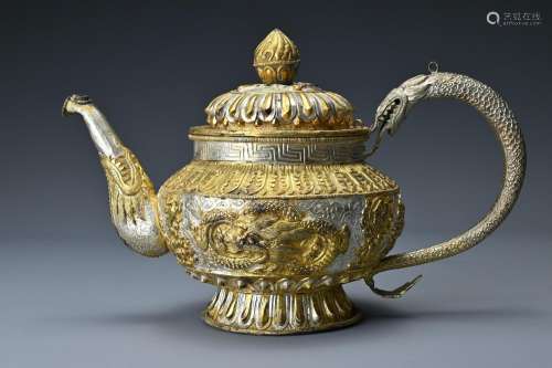 A Tibetan gilt metal teapot/ewer and cover. The body