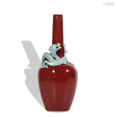 A red glazed vase