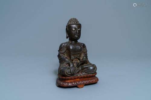 A Chinese bronze figure of Buddha Ming Dynasty