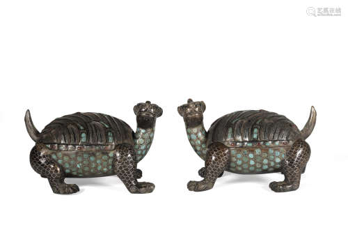 A pair of bronze beast ware with silver