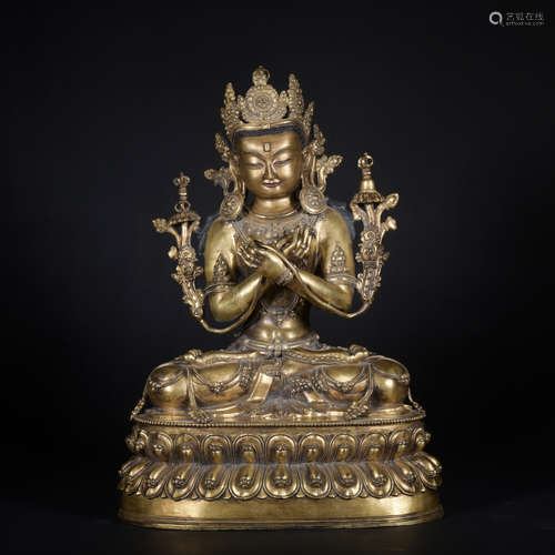 A gilt-bronze statue of Manjusri