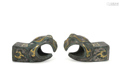 A pair of bronze beast ware with gold and silver