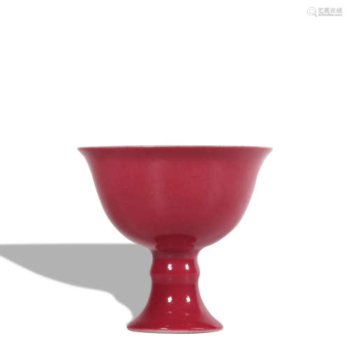A red glazed stem cup