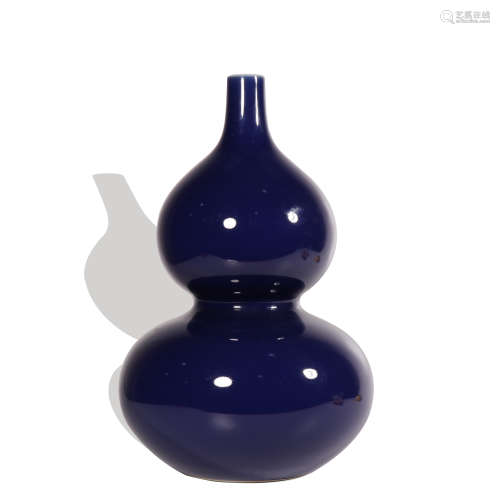 A blue glazed gourd-shaped vase