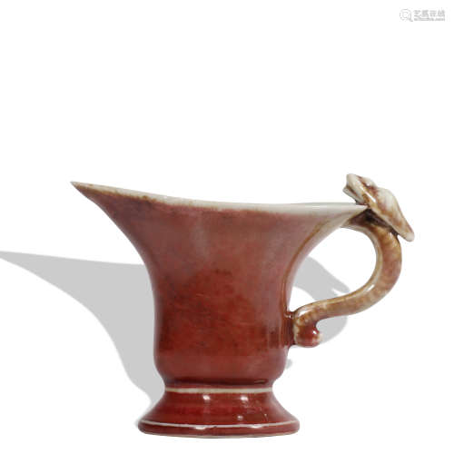 A red glazed wine cup