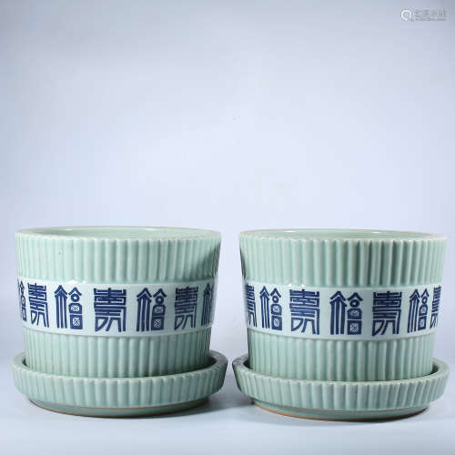 A pair of Qing Dynasty green glazed flowerpots