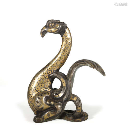 A bronze beast ware with gold and silver