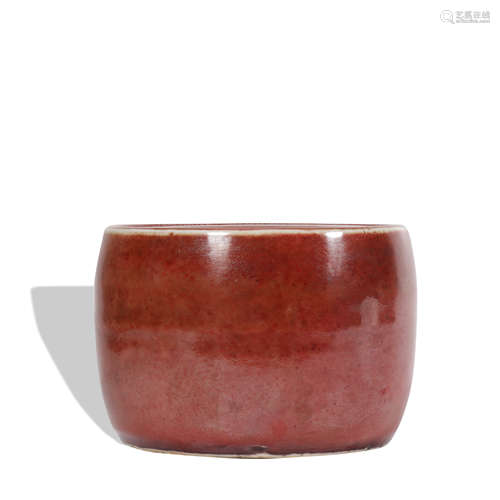 A red glazed jar and cover