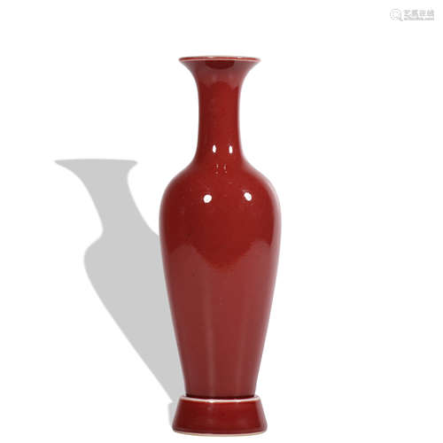 A red glazed vase