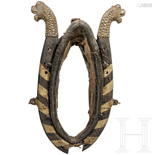 A South German horse collar with carved decoration,