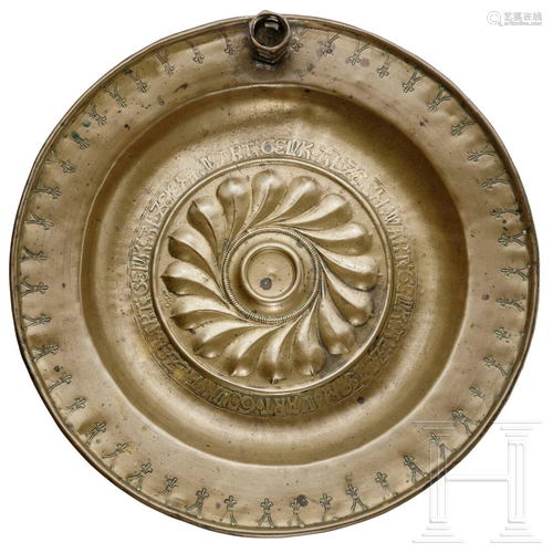 An alms dish with candle socket, Nuremberg, circa 1500