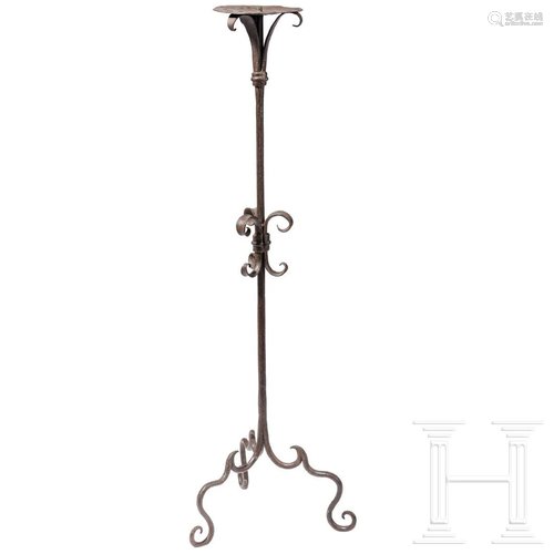 A large Italian wrought iron candlestick, 17th century