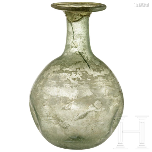 A bellied Roman glass bottle, 1st - 3rd century