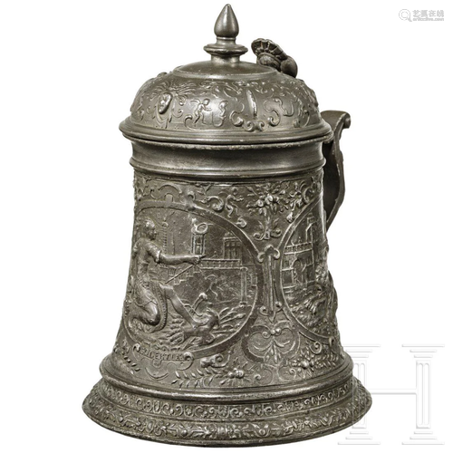 A pewter tankard with relief decoration by Isaac Faust,