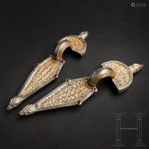 A pair of large Ostrogothic silver bow brooches, mid