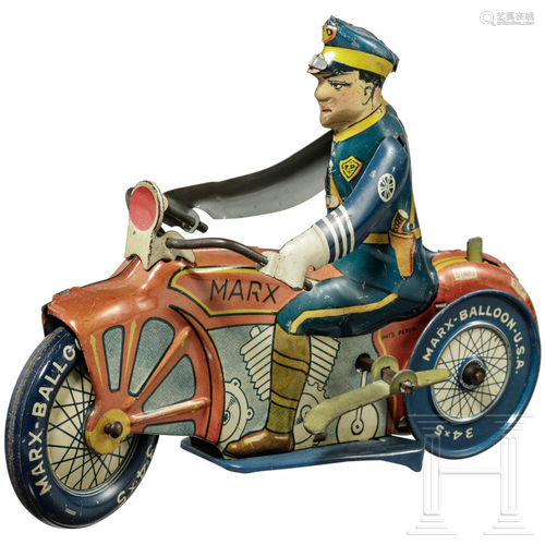 A Marx Toys motorcycle policeman with windup key