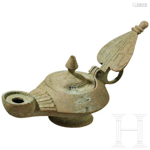 A Byzantine bronze oil lamp, 6th century