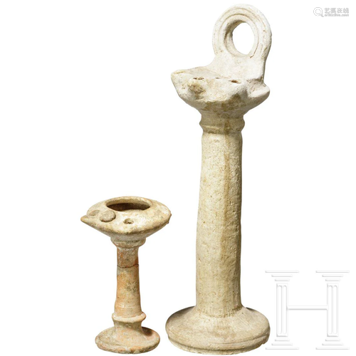 Two tall Byzantine oil lamps, 5th - 9th century