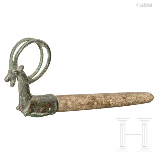 A whetstone with bronze ram's head finial, Luristan,