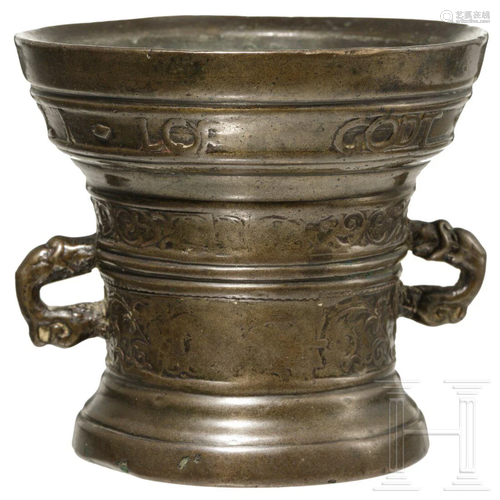 A small Dutch bronze mortar with dolphin handles, dated