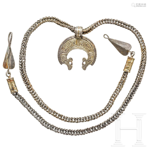 A rare Viking dragon head lunula pendant on necklace,