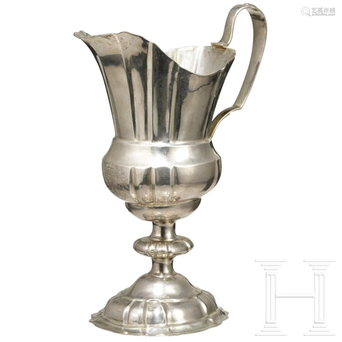 A silver helmet jug with the coat of arms of General