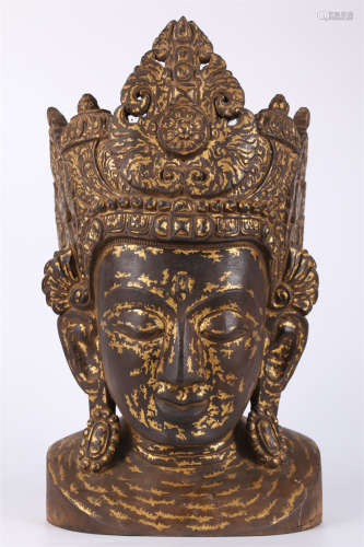 A Wooden Buddha's Head Sculpture.