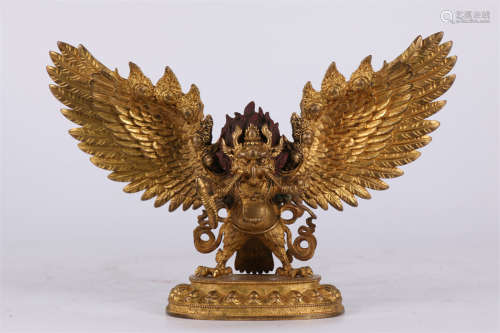 A Gilt Copper Suparna Buddha Statue.