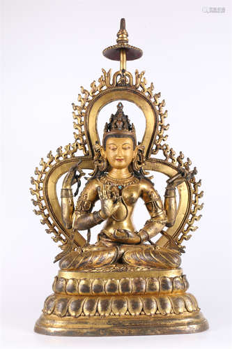 A Four-Arm Guanyin Bodhisattva Statue.