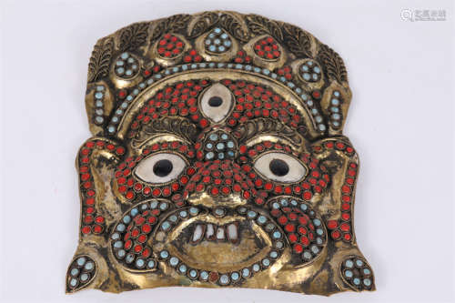 A Gilt Copper Mask, Inlaid with Jewels.