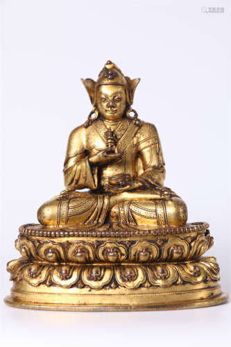 A Gilt Copper Guru Buddha Statue.