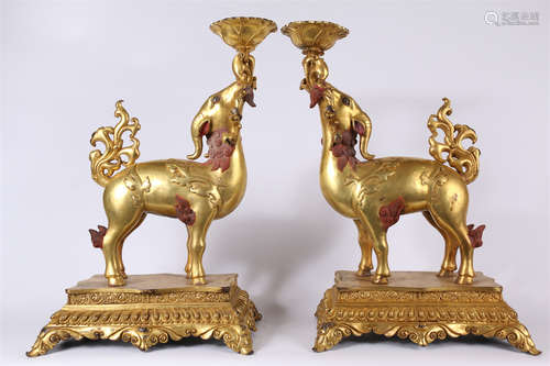 A Set of Gilt Copper Offering Lamps.