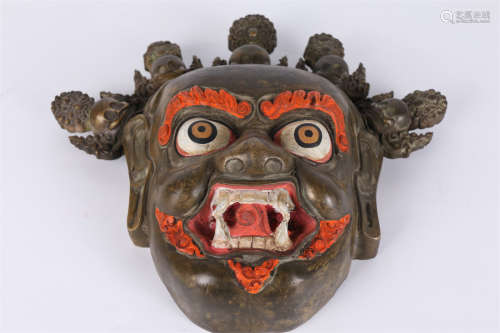 A Gilt Copper Mask.