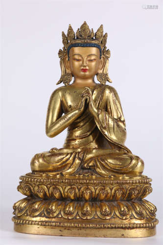 A Gilt Copper Vairocana Buddha Statue.