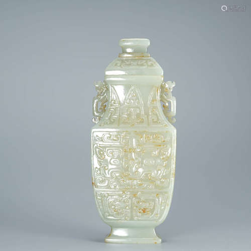 A Carved Celadon Jade Double-Eared Vase