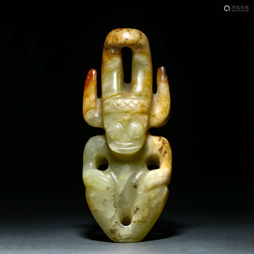 A Carved Greenish Jade Figure