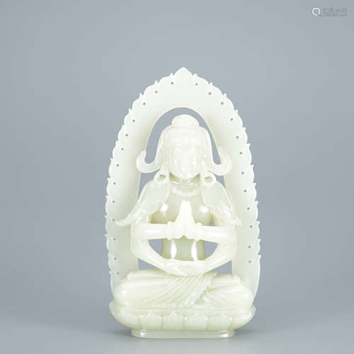 A Carved White Jade Buddha with Halo