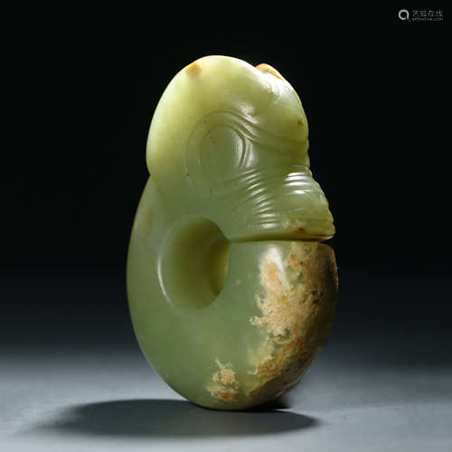 A Carved Greenish Jade Dragon Ornament